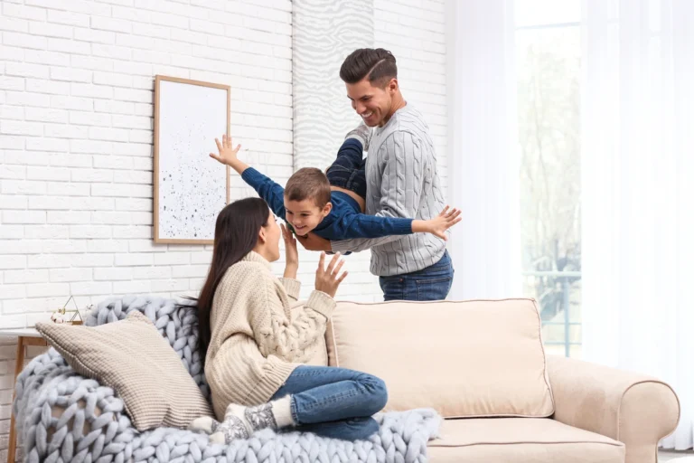 family of three happy at home