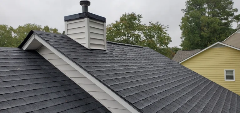 black asphalt shingles on a cream colored home