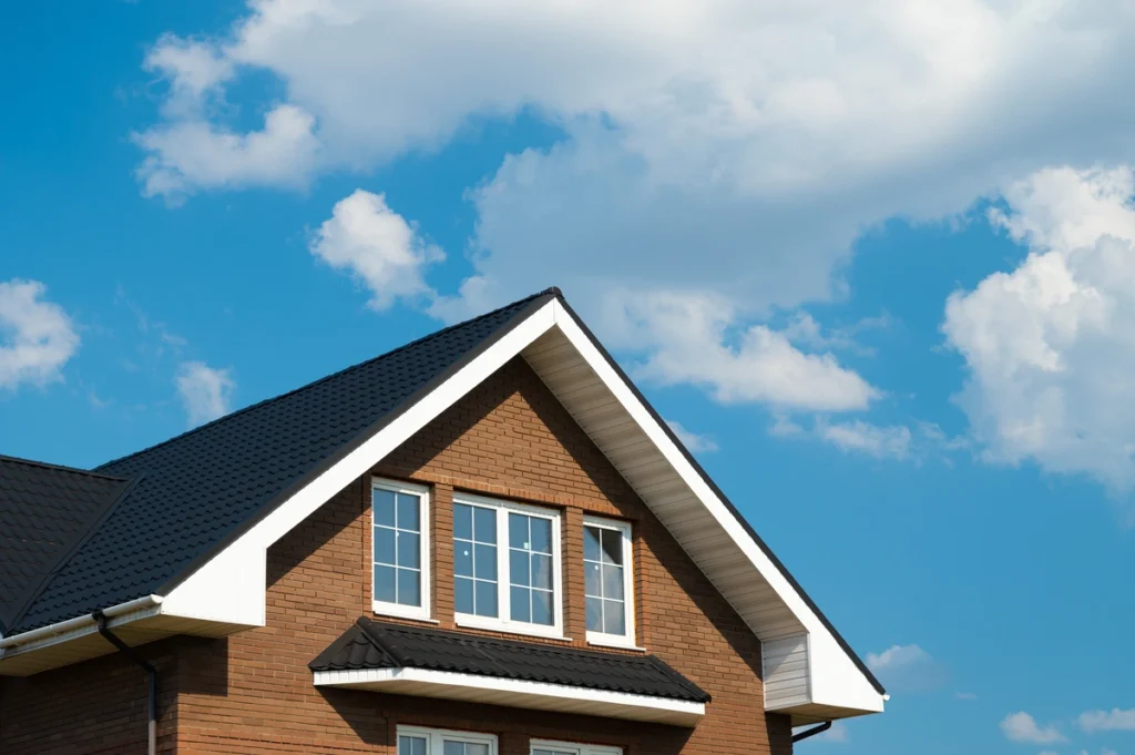 brick house with metal rile roof