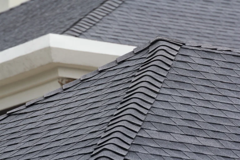 corner of a roof with black asphalt shingles in Wells, IA