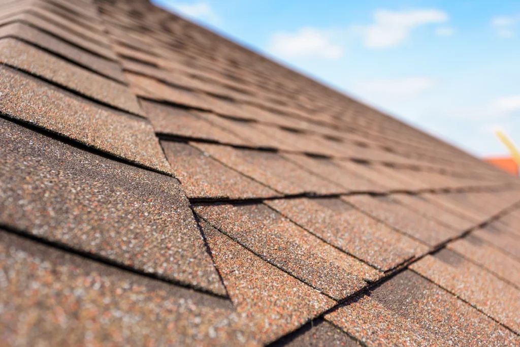 up close view of brown asphalt shingles on a residential home