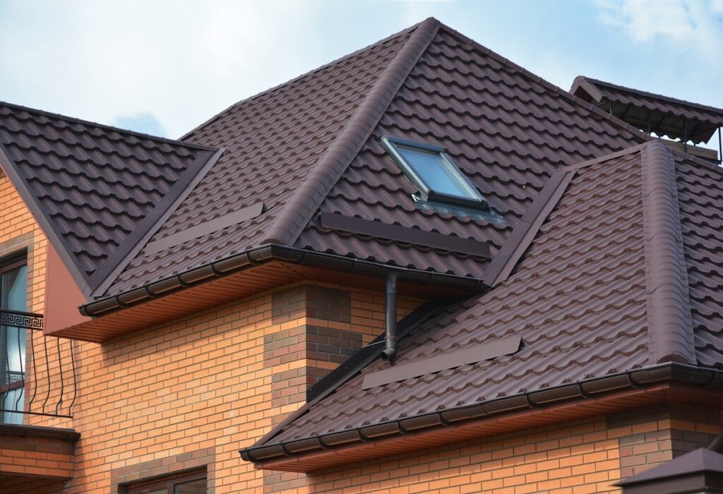 Brown metal roofing material installed on older home