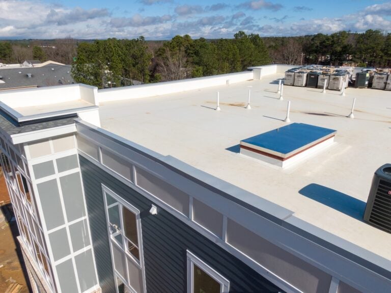 Drone photo of a white commercial roof with tpo roofing