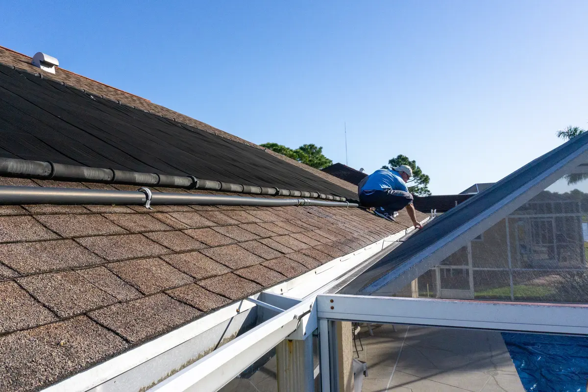 inspector on shingle roof